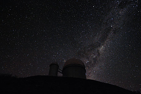 The Milky Way and Alpha and Beta Centauri behind the 3.6-metre telescope at La Silla