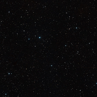 Wide-field view of the sky around the brown dwarf binary CFBDSIR 1458+10