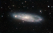 Pohled skrze WFI (Wide Field Imager) na spirální galaxii NGC 247