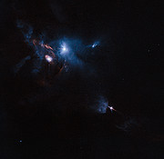 Imagem Hubble da região em torno da jovem estrela HL Tauri