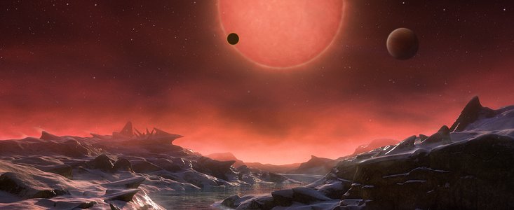 Artist’s impression van de ultrakoele dwergster TRAPPIST-1, gezien vanaf het oppervlak van een van zijn planeten