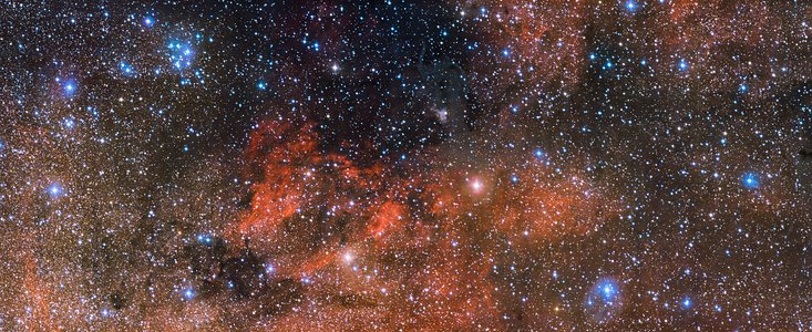 O enxame estelar Messier 18 e o seu meio envolvente