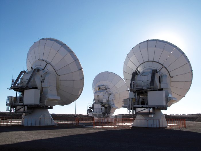 Three ALMA antennas close together on Chajnantor