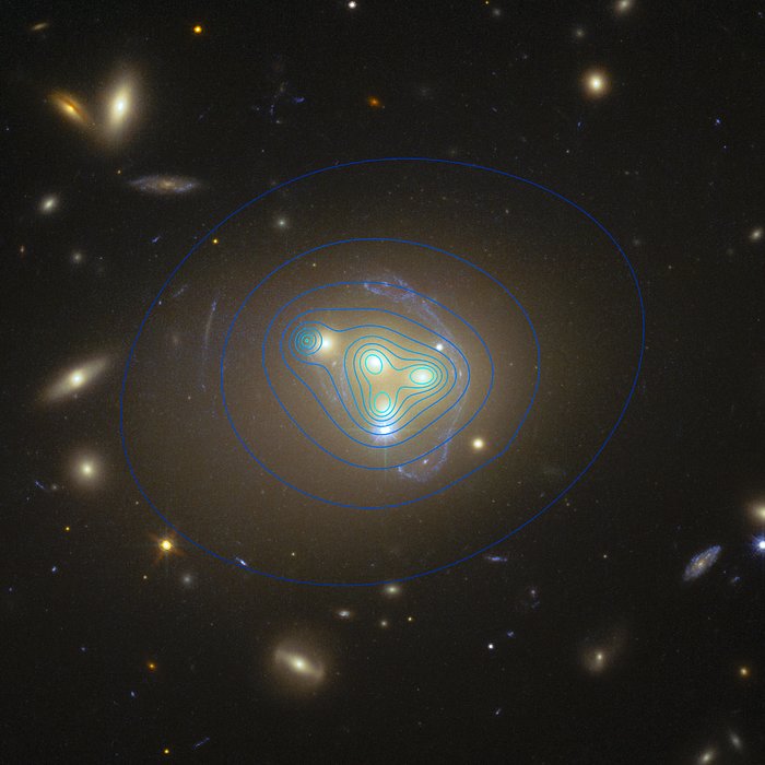 Hubble-foto van de cluster Abell 3827, waarop de verdeling van de donkere materie te zien is