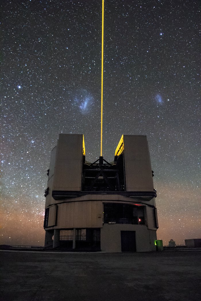 Solitary laser guide star divides the Magellanic Clouds