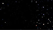 Vi zoomer ind i galaksehoben Abell 1689 og ender ved en meget fjern og meget støvet galakse