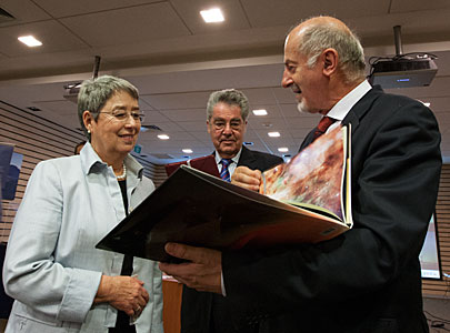 The President of Austria, Heinz Fischer and his wife Margit Fischer are shown the book "Voices from the Universe"