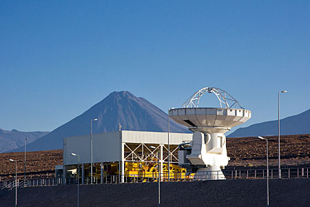 ALMA antenna at OSF, in front of Transporter Shelter and Licancabur volcano