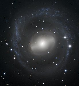 Barred Spiral Galaxy Swirls in the Night Sky