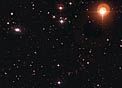 Galaxy ESO 570-19 and Variable Star UW Crateris