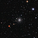An Ancient Cluster of Stars Against a Stunning Background