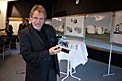 Architect of the Visitor Centre showing a model of the planned building