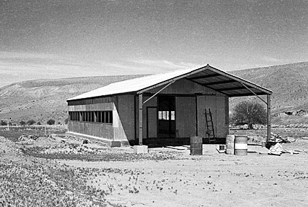 Building a house at Pelicano camp