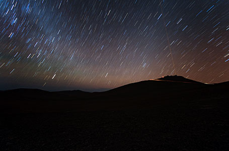 Group Portrait of the VLT with Laser Beam