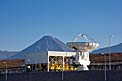 ALMA antenna at OSF, in front of Transporter Shelter and Licancabur volcano