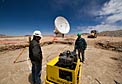 Antenna pad construction work on Chajnantor, in front of an ALMA antenna