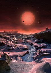 Představa pohledu na chladného trpaslíka TRAPPIST-1 z povrchu jedné z jeho planet