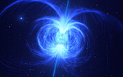 A dynamic blue sphere, the massive star, is at the centre of this image, with powerful blue magnetic field lines all around it. The field lines look wispy and fine but are densely packed, especially near the star itself. The lines shoot out of the surface of the star, especially at the poles, and curl back around on themselves in closed loops that end on the other side of the star's equator. Some do this close to the star in tightly wound loops, while others extend out to the edge of the frame, looping back in long arcs.