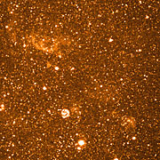 Stars and Nebulae in dwarf galaxy NGC 6822