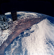 The Hubble Space Telescope flies over South America