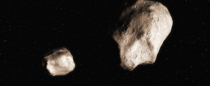 An asteroid that has split due to rotational fission (artist’s impression)