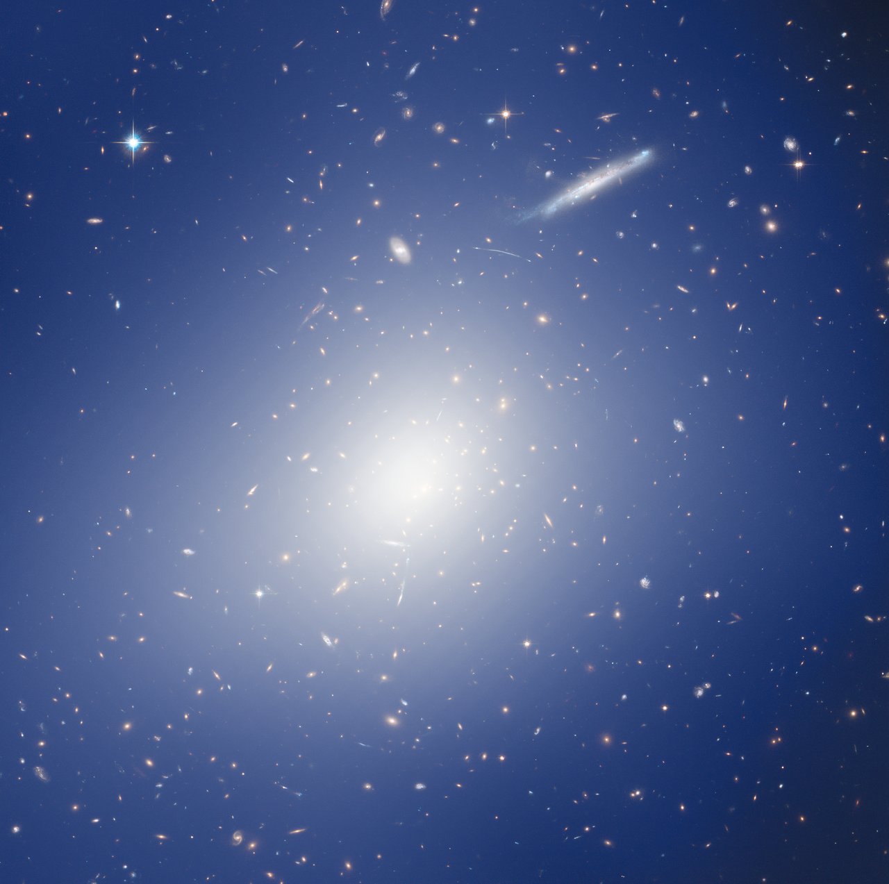 HAWK-I and Hubble Explore a Cluster with the Mass of two Quadrillion Suns