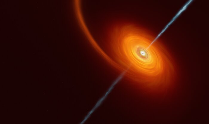 Dieses Bild zeigt eine helle Spirale vor dem dunklen Hintergrund des Weltraums, die an den äußeren Rändern ein tiefes Orange aufweist und zur Mitte hin viel heller wird und sich der gelben oder sogar weißen Farbe annähert. Im Zentrum befindet sich ein schwarzes Loch, aus dem weiß-blaue Ströme herausschießen. Diese Jets treten an beiden Polen des schwarzen Lochs aus und verlaufen senkrecht zur Spiralscheibe.