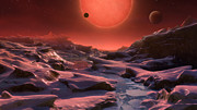 Rappresentazione artistica della nana ultrafredda TRAPPIST-1 vista dalla superficie di uno dei suoi pianeti